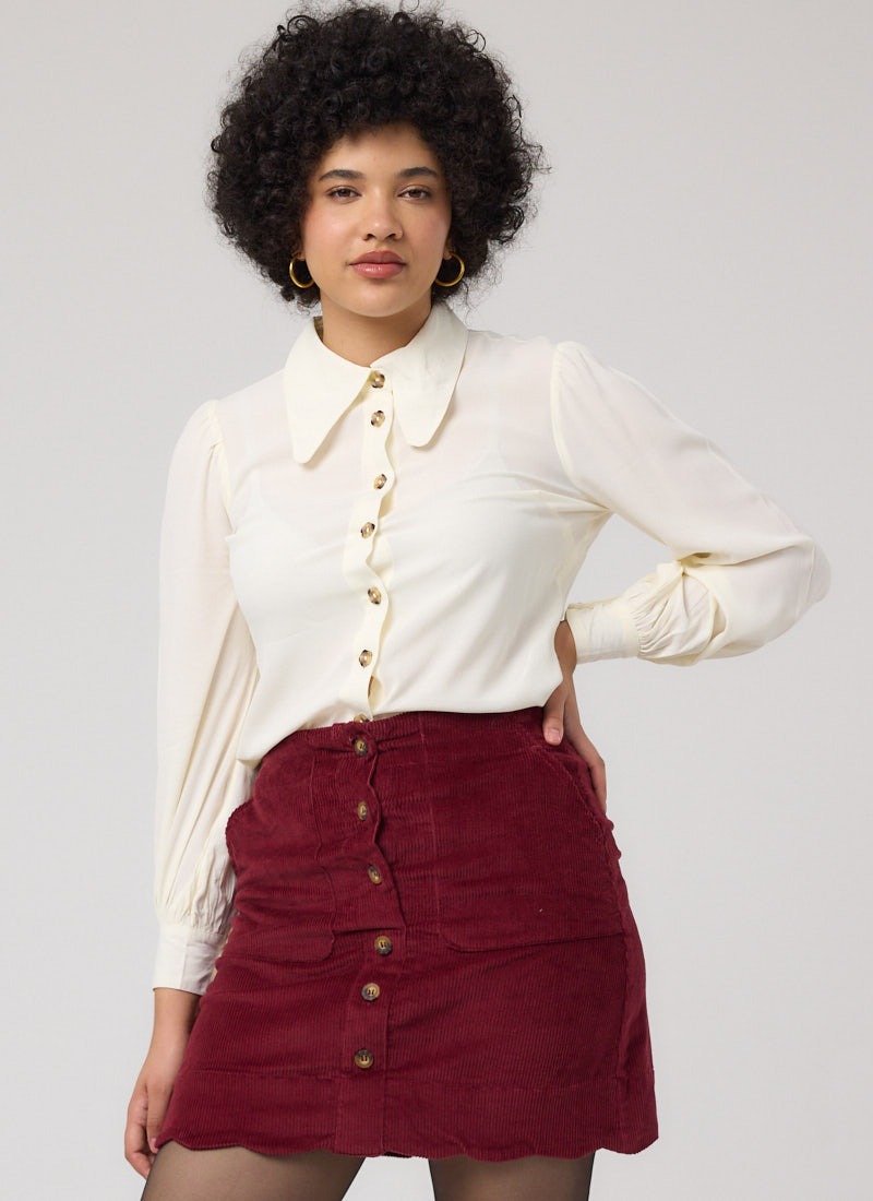 Sarah Scallop Hem A-Line Corduroy Mini Skirt - Burgundy - Fiona Balloon Sleeve Blouse - Cream - Model Front
