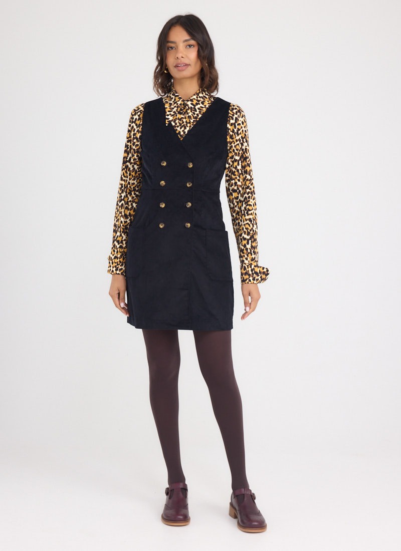 Kendal A-Line Buttoned Corduroy Pinafore Dress - Black - Model Front Full Length - Velma Leopard Print Dagger Collar Blouse
