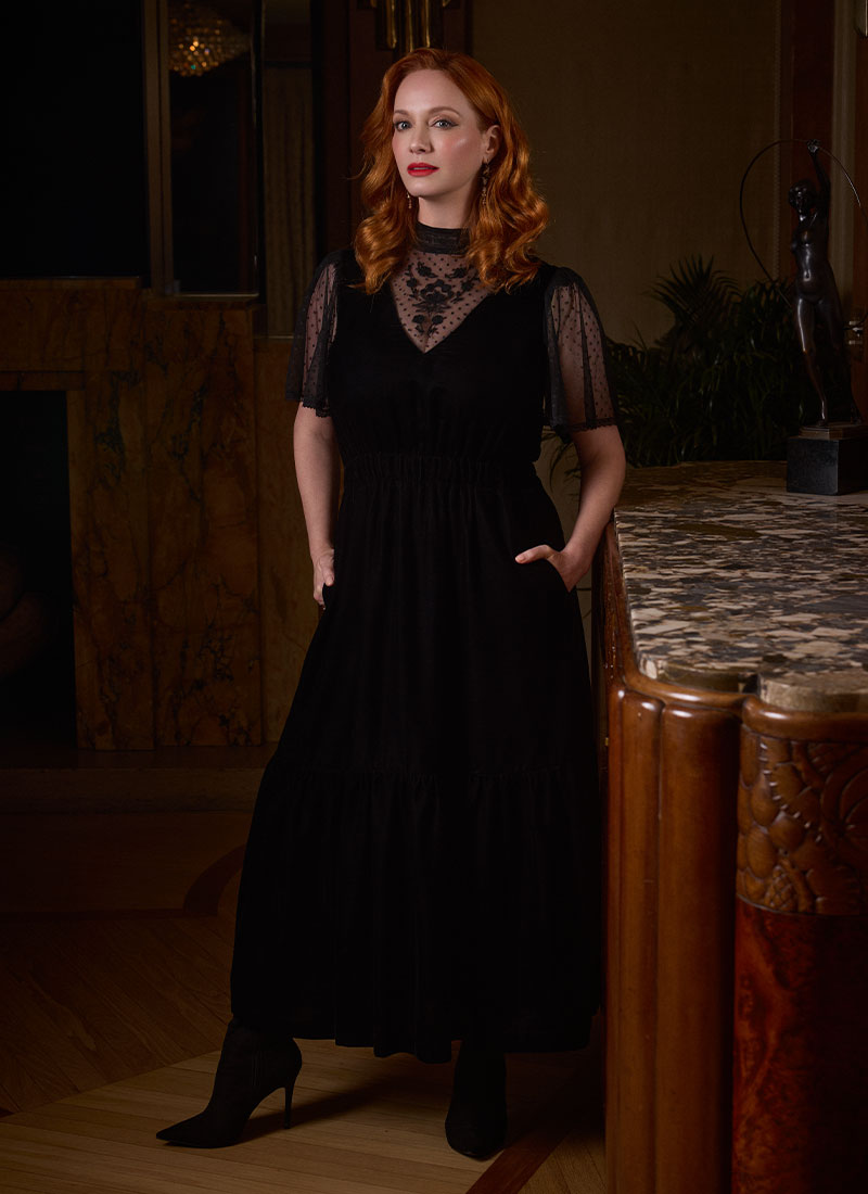 Christina Hendricks X Joanie - Immortal Flower High Neck Velvet Maxi Dress - Christina Front Hands In Pockets