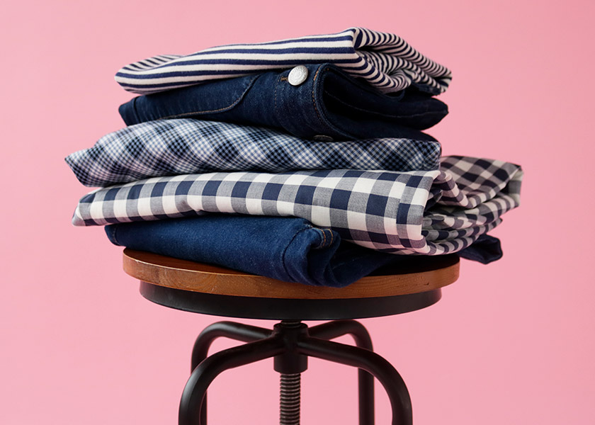 FOLDED CLOTHES ON A STOOL